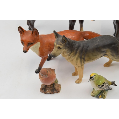 64C - Beswick to include large standing fox 1016, brown swishtail (ear chipped), elephant (tusk af), a mat... 