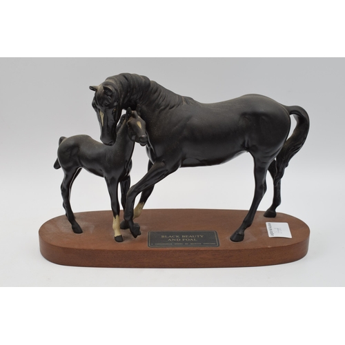 64A - Beswick Black Beauty and Foal on wooden base.