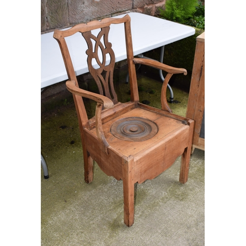 440 - Pine commode chair with ornate back and ceramic liner, 103cm tall.