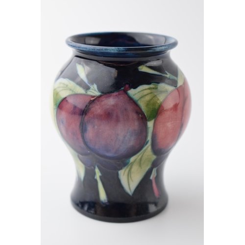 100 - Early Moorcroft bulbous vase in the Wisteria pattern, 8.5cm tall.