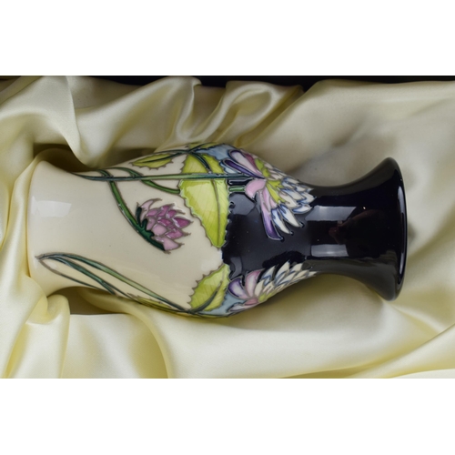 104 - Boxed Moorcroft set of 3 vases in the Trefoil design in presentation box, tallest 20.5cm tall (3).