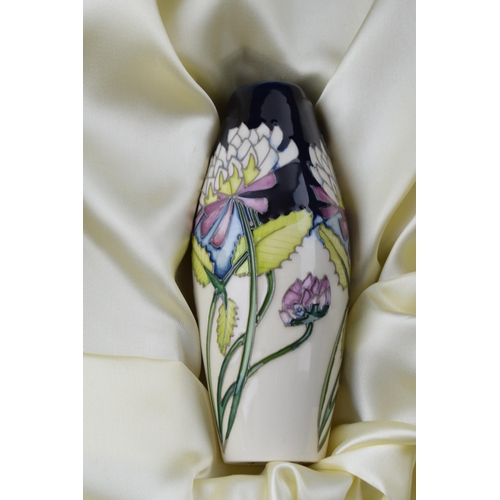 104 - Boxed Moorcroft set of 3 vases in the Trefoil design in presentation box, tallest 20.5cm tall (3).