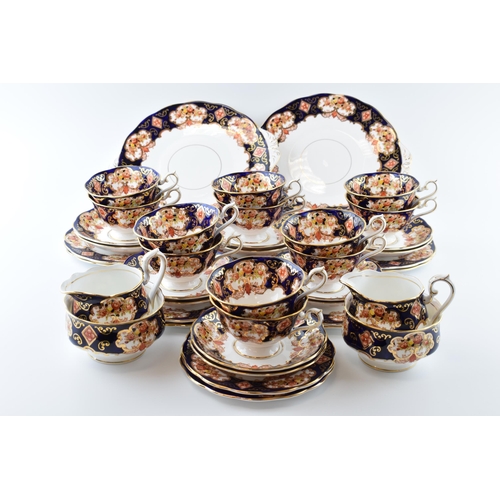 165 - Royal Albert Heirloom tea ware to include 12 cups, 12 saucers, 12 side plates, 2 milk jugs, 2 sugar ... 