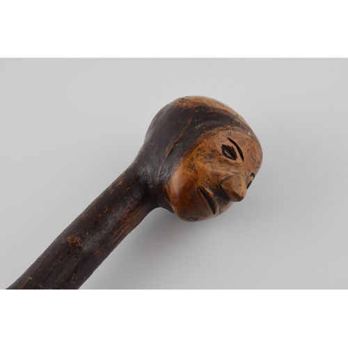 181 - Early 20th century folk art walking stick with carved figural head, 89cm tall.