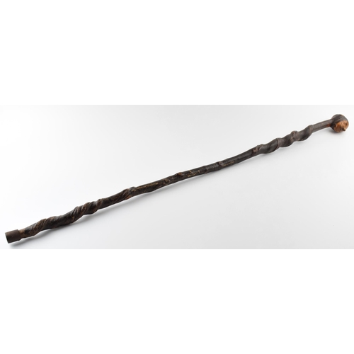 181 - Early 20th century folk art walking stick with carved figural head, 89cm tall.