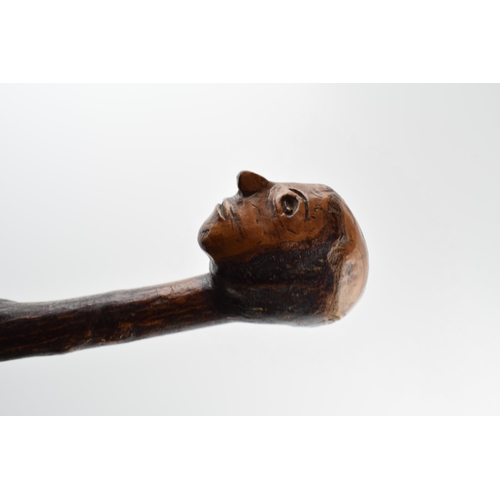 181 - Early 20th century folk art walking stick with carved figural head, 89cm tall.