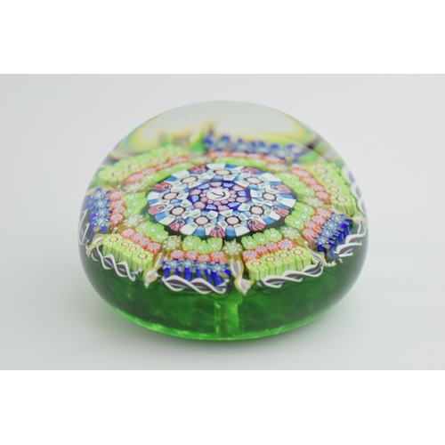 189 - Perthshire millefiori paperweight with multicoloured design, 7cm diameter, with arrow mark to centre... 