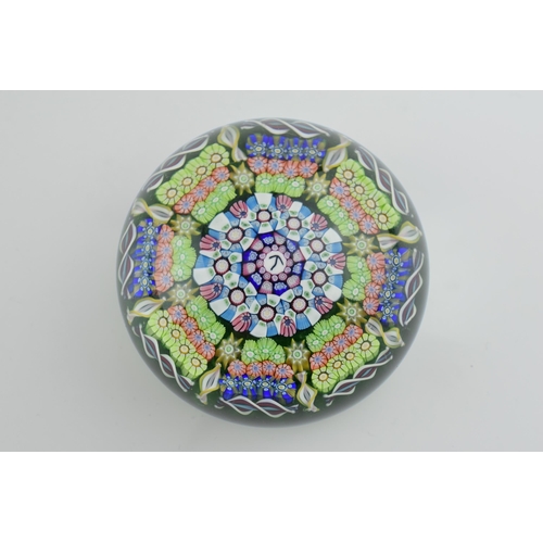 189 - Perthshire millefiori paperweight with multicoloured design, 7cm diameter, with arrow mark to centre... 