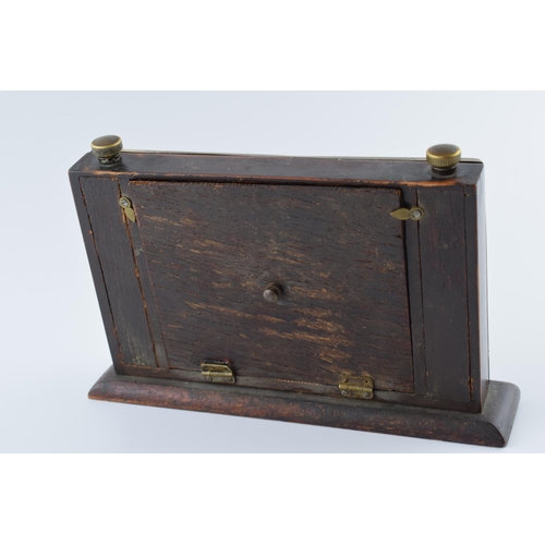 192 - 1930s brass fronted perpetual calendar complete with month and date cards with working scroll.