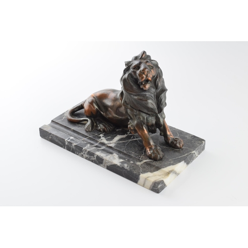 193 - French Art Deco inkwell in the form of a lion mounted onto marble, 23cm long.