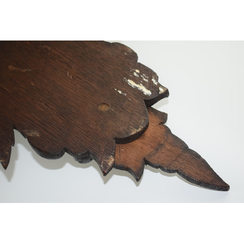 195 - Large Black Forest carved shelf with an eagle amongst foliage, 56cm long.