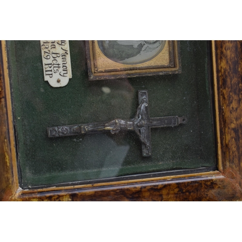 197 - Framed Memento Mori containing lock of hair, carved wooden skull, crucifix, and plaque that reads 