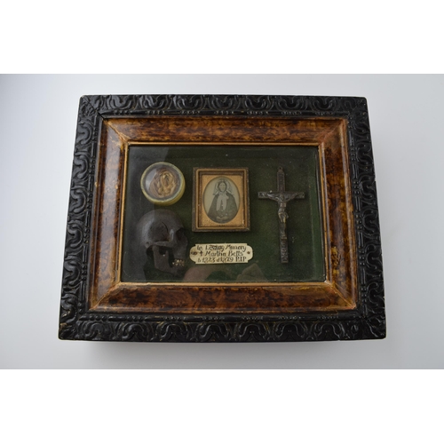 197 - Framed Memento Mori containing lock of hair, carved wooden skull, crucifix, and plaque that reads 