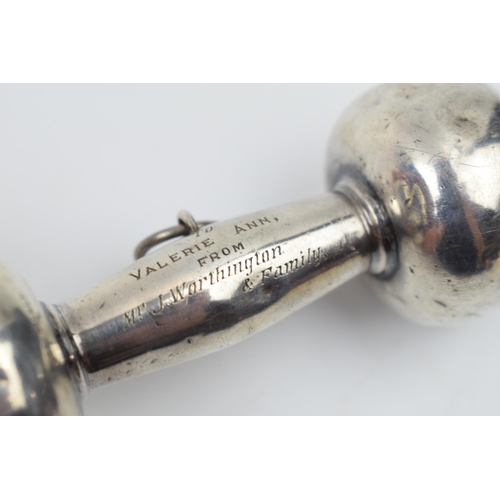 441 - Silver baby rattle in the form of a dumbbell, 28.2 grams, 8.5cm long.