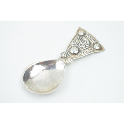 445 - Hallmarked silver caddy spoon in Arts and Crafts style, 16.8 grams, Birmingham 1936.