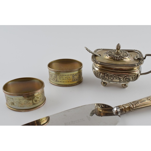 451 - A collection of hallmarked silver items to include a cruet, a pair of napkin rings, weighable silver... 