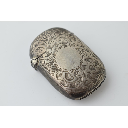 466 - Hallmarked silver vesta case with engraved decoration, 19.2 grams, Birmingham 1899.