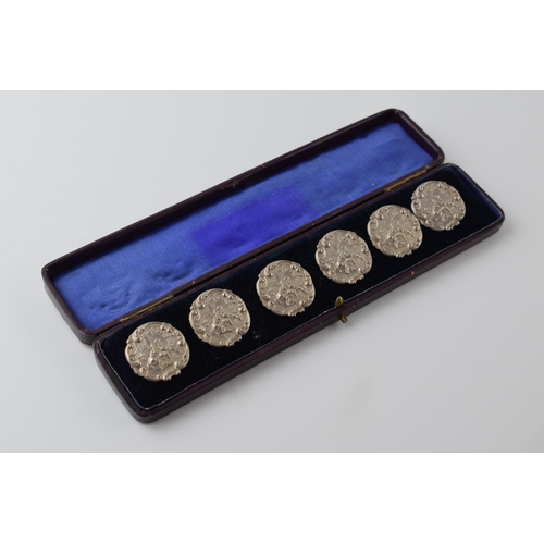 471 - Boxed set of 6 matching sterling silver buttons with a figural scene, stamped '925.