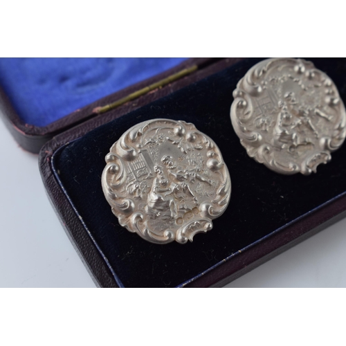 471 - Boxed set of 6 matching sterling silver buttons with a figural scene, stamped '925.