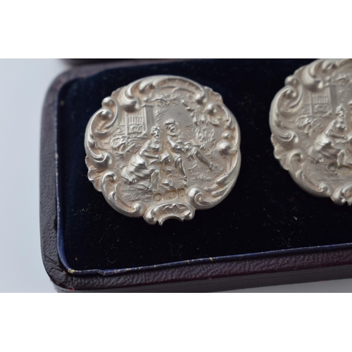 471 - Boxed set of 6 matching sterling silver buttons with a figural scene, stamped '925.