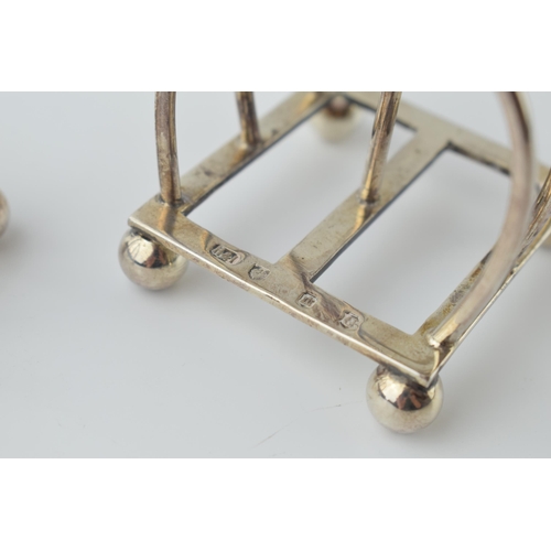 486 - A pair of hallmarked silver unusual 3 bar toast racks, Edinburgh 1912, Hamilton & Inches, 100.5 gram... 