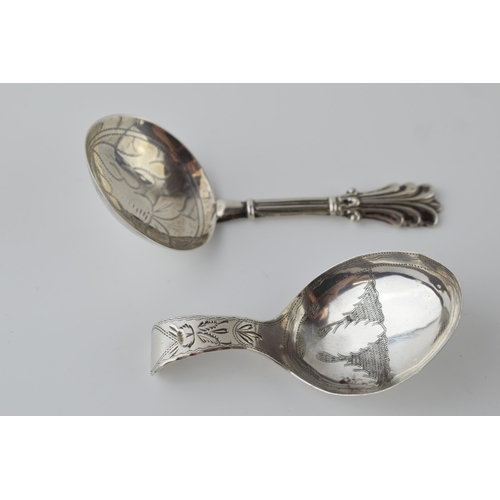 488 - A pair of silver caddy spoons to include a Georgian Birmingham 1809 Cocks & Bettridge spoon with a G... 