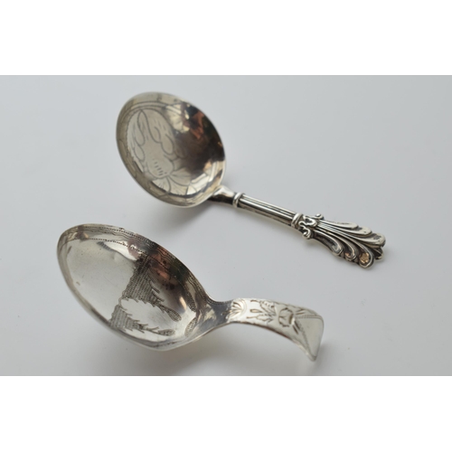 488 - A pair of silver caddy spoons to include a Georgian Birmingham 1809 Cocks & Bettridge spoon with a G... 