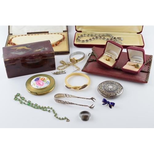 548 - Jewellery to include a 9ct gold fronted tie pin, a pair of silver sugar tongs, white metal eastern p... 