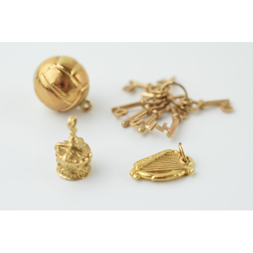 550 - 9ct gold bracelet charms to include a football, a harp / lyre, a crown and a set of keys 'I LOVE YOU... 