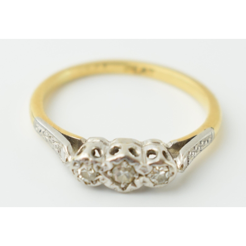 552 - 18ct gold and platinum ladies 3 stone diamond ring, size L, 2.0 grams.