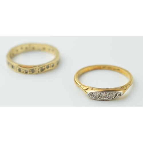 553 - An 18ct gold and platinum 5 stone diamond boat ring, 2.4 grams, size O, with a 9ct gold eternity rin... 