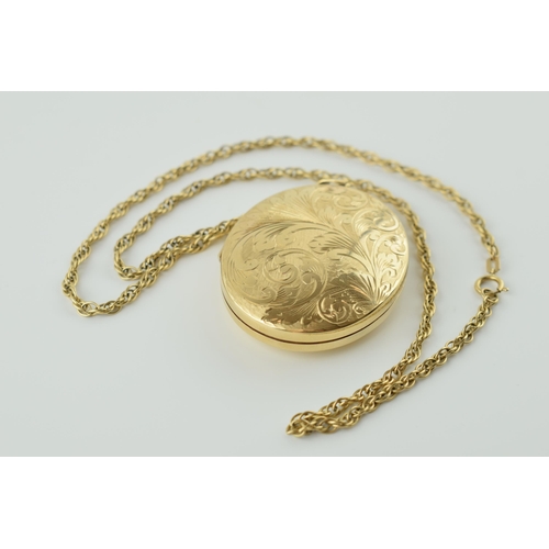 555 - 9ct gold large locket with engraved floral decoration on 9ct gold link necklace, 34.2 grams, with or... 