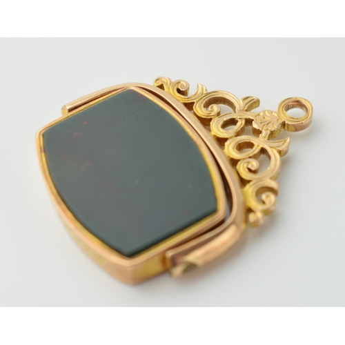 562 - 9ct gold swivel fob with bloodstone and ornate link, 6.6 grams, 3cm tall.