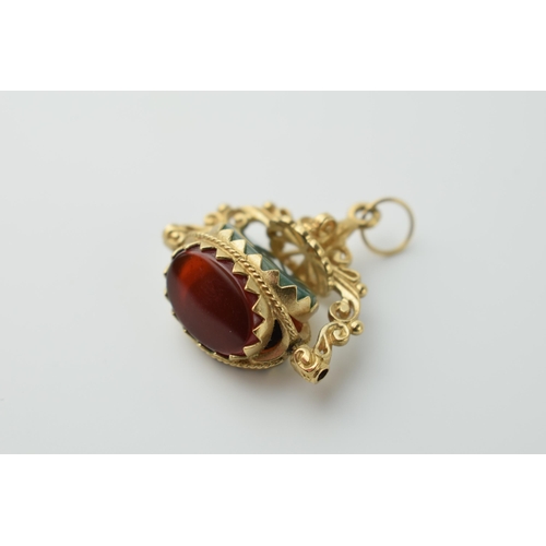 563 - 9ct gold three stone swivel watch fob set with onyx,  carnelian and jade (or similar), 6.0 grams, 26... 