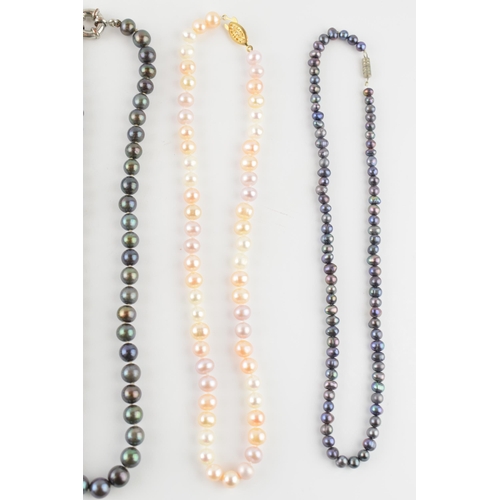 570 - A collection of 4 faux pearl necklaces of varying colours (4).