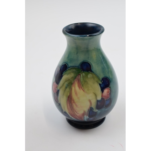 77 - Moorcroft Leaf and Berries vase, 7/4, signed by William Moorcroft, 10cm tall.