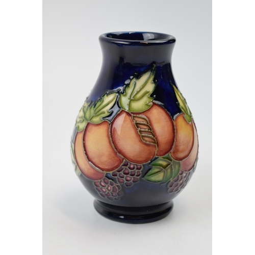 78 - Moorcroft trial vase decorated with fruit and leaves, 7/4, 10cm tall.