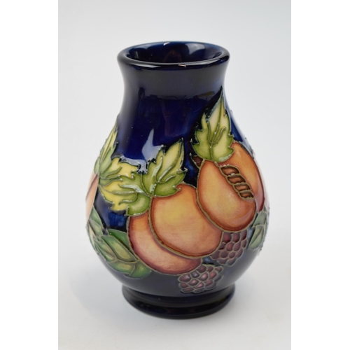 78 - Moorcroft trial vase decorated with fruit and leaves, 7/4, 10cm tall.