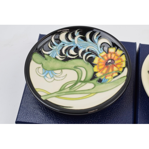 82 - Boxed Moorcroft pin trays to include Lily Plume 780/4 and Tembusu (2).