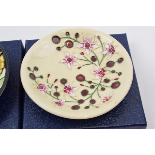 82 - Boxed Moorcroft pin trays to include Lily Plume 780/4 and Tembusu (2).