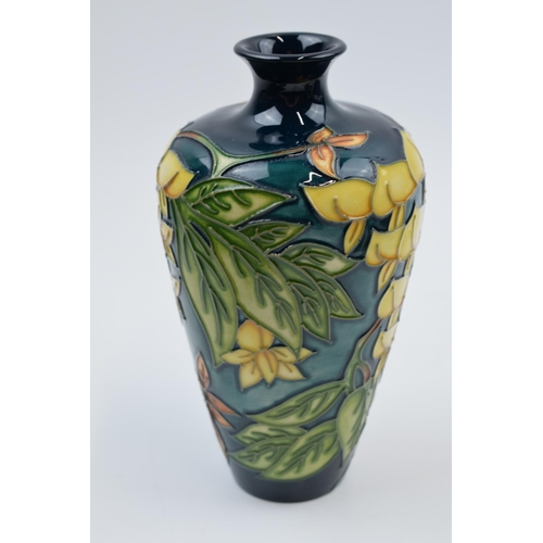 87 - Boxed Moorcroft floral vase in the 'Wisteria' pattern, 72/6, silver line, 15.5cm tall.