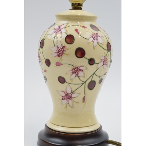 94 - Moorcroft lamp in the Tembusu pattern mounted onto wooden base, 27cm tall inc fittings.