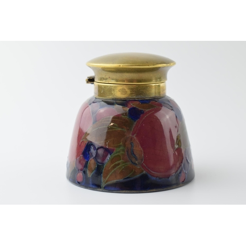 97 - Moorcroft Pomegranate inkwell with brass hinged lid, impressed 'Moorcroft', 7.5cm tall.