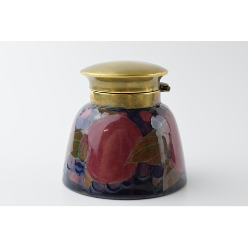 97 - Moorcroft Pomegranate inkwell with brass hinged lid, impressed 'Moorcroft', 7.5cm tall.