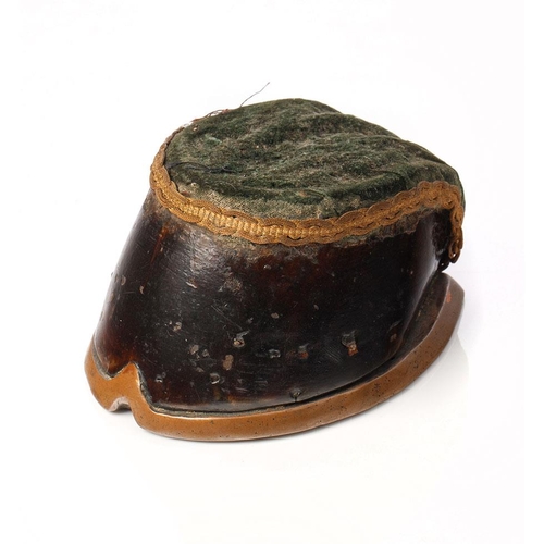 272 - Victorian taxidermy horse's hoof pin cushion with brass shoe and velvet cushion, 14cm long.