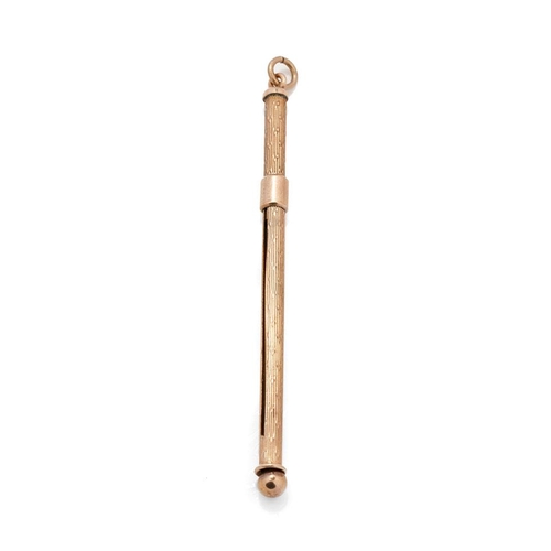 544 - 9ct gold mechanical cocktail stirrer / swizzle stick, 12.5cm extended, 5.0 grams gross weight.