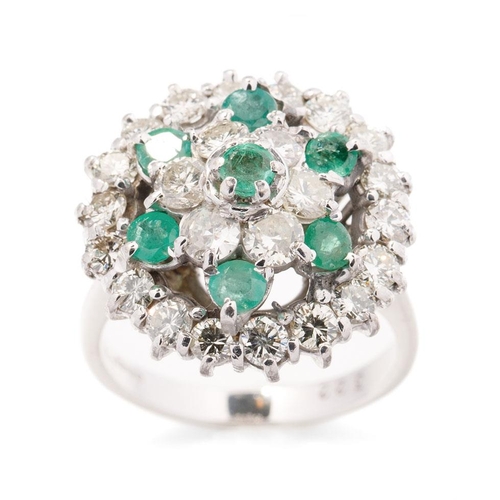 633 - 18ct gold ring set with 1.5ct of diamonds and emeralds, size 7.2 grams, size L/M.