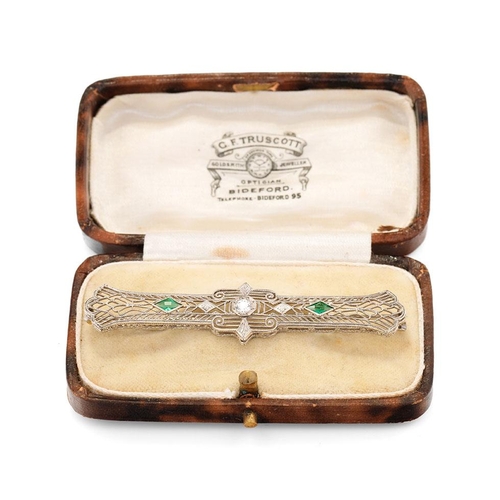 640 - 14ct white gold filigree brooch set with 0.2ct diamond and emeralds, 65mm wide, 3.8 grams, in origin... 