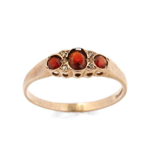 657 - 9ct gold diamond and garnet ring, 2.0 grams, size T.