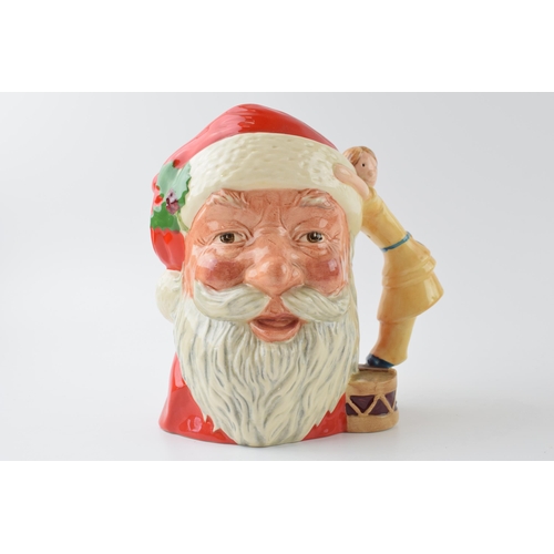 130 - Large Royal Doulton character jug Santa Claus with toy doll handle D6668.